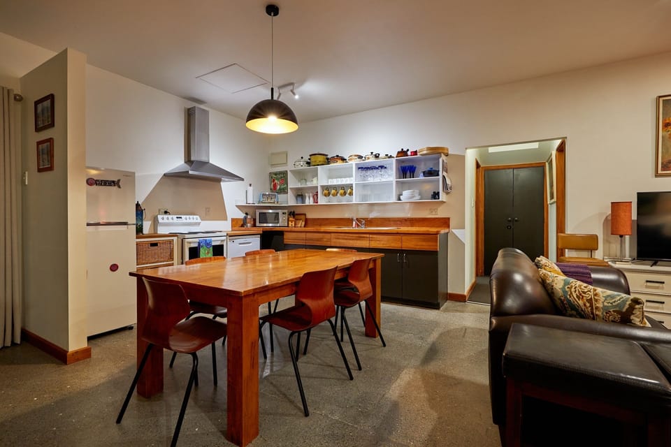 Kitchen/dining and living areas with sea and mountain views