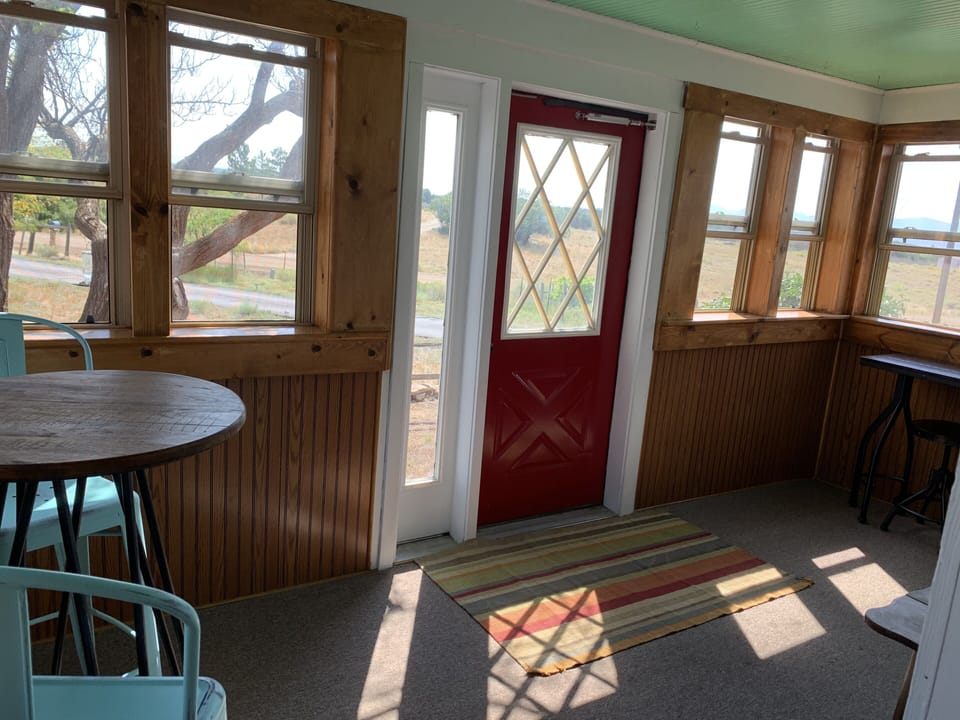 The front room is perfect for enjoying a cup of coffee and soaking in the views.