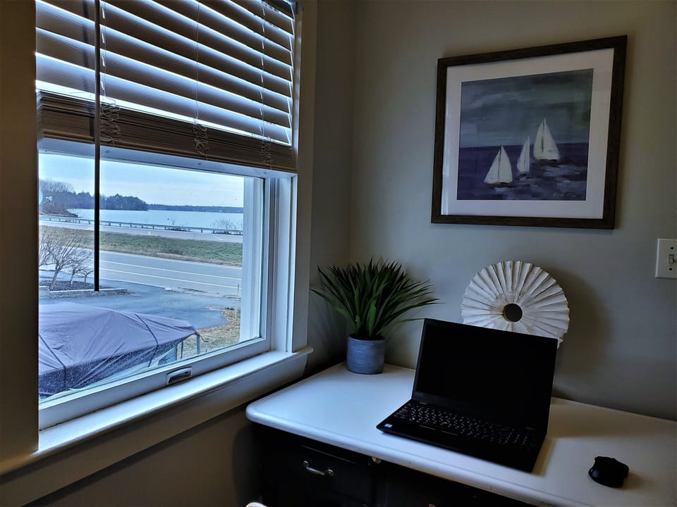 Desk for remote work with view of Casco Bay