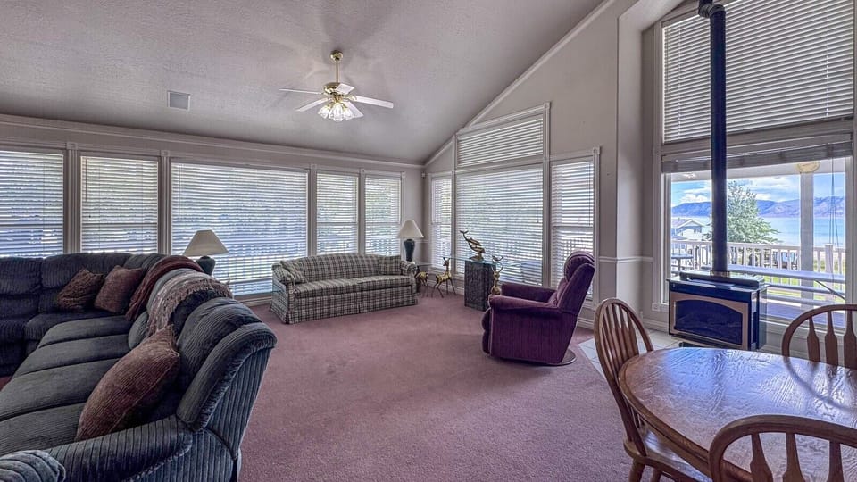 Unwind together in a spacious gathering room with cozy seating and beautiful Bear Lake views.