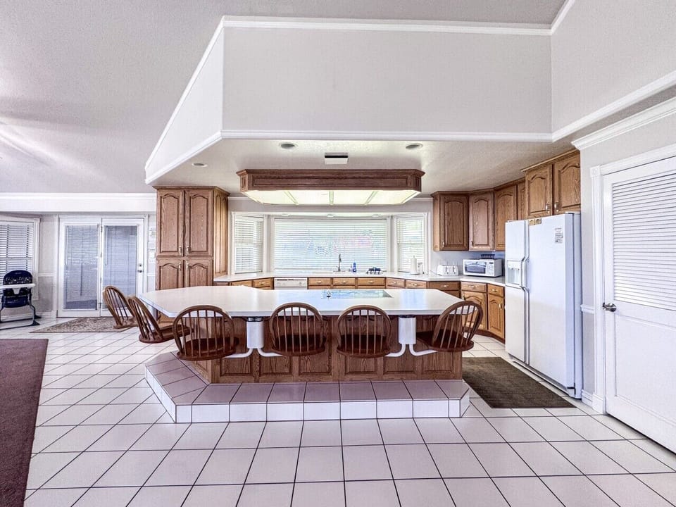 Spacious kitchen with panoramic views and ample seating—perfect for cooking, dining, and making memories