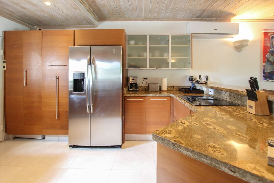 The fully outfitted kitchen has all you'll need while on holiday. Ask our concierge about pre-delivering groceries!