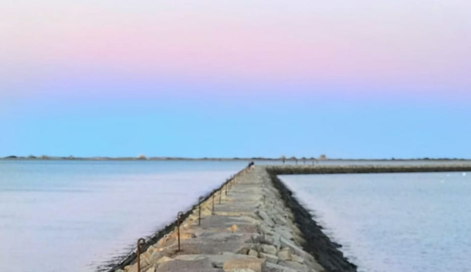 Take a stroll on the jetty into Plymouth Harbor. An evening delight.