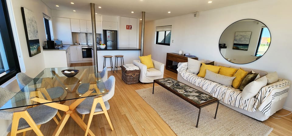 Spacious open planned living, dining and kitchen with sizeable balcony.  Views!