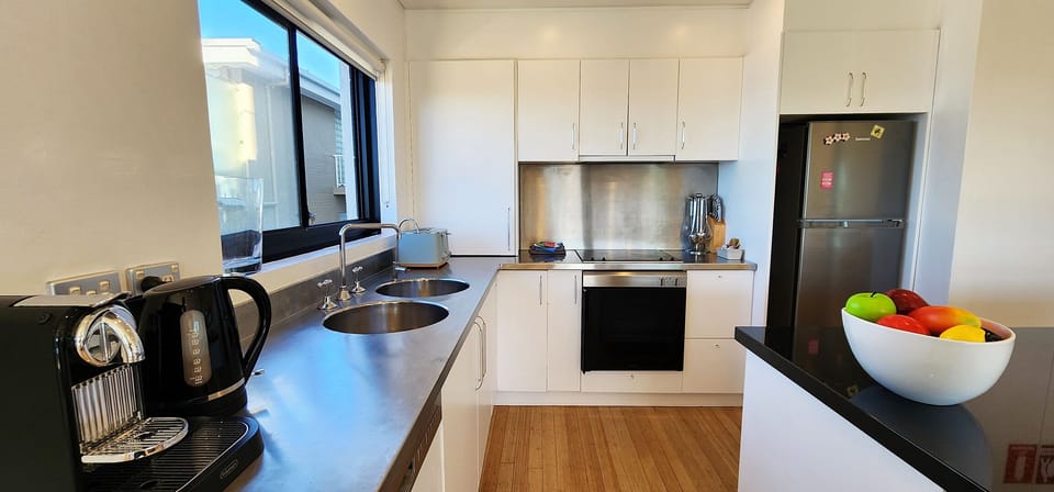 Well equipped kitchen with dishwasher, microwave, Nespresso coffee machine.