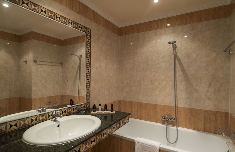 Bathtub, free toiletries, hair dryer, bathrobes
