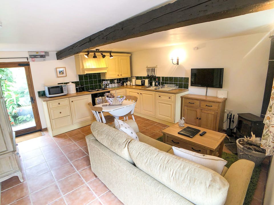 Kitchen has oven, hob, grill, fridge, freezer, dishwasher & microwave.