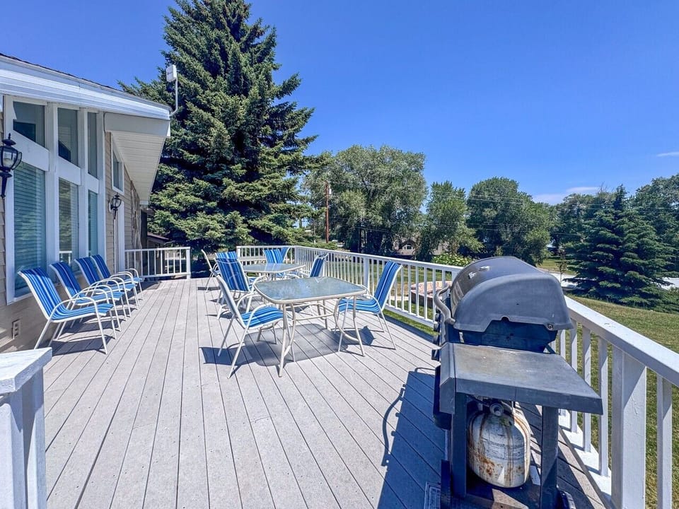 Spacious deck with grilling area, outdoor dining, and plenty of room to relax together.