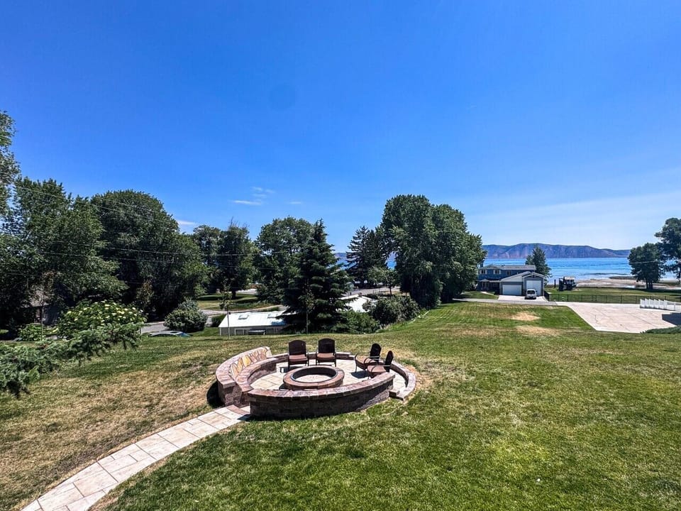 Gather around the fire pit and savor peaceful Bear Lake views under open skies.