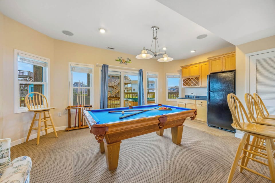 Challenge your group to a game on the beautiful pool table, then step out onto the deck for fresh air and sunshine—perfect for friendly competition and lasting memories.