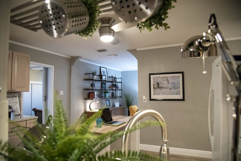 Peeking from the dining room into the kitchen and beyond.