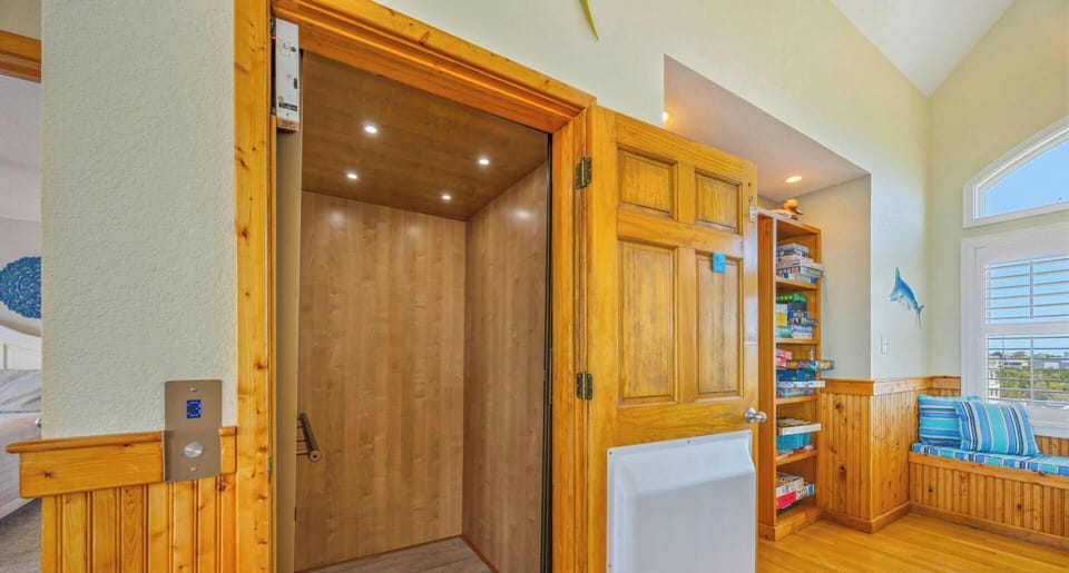 Step into your private elevator, beautifully crafted with warm wood finishes that seamlessly blend comfort with convenience throughout your stay.