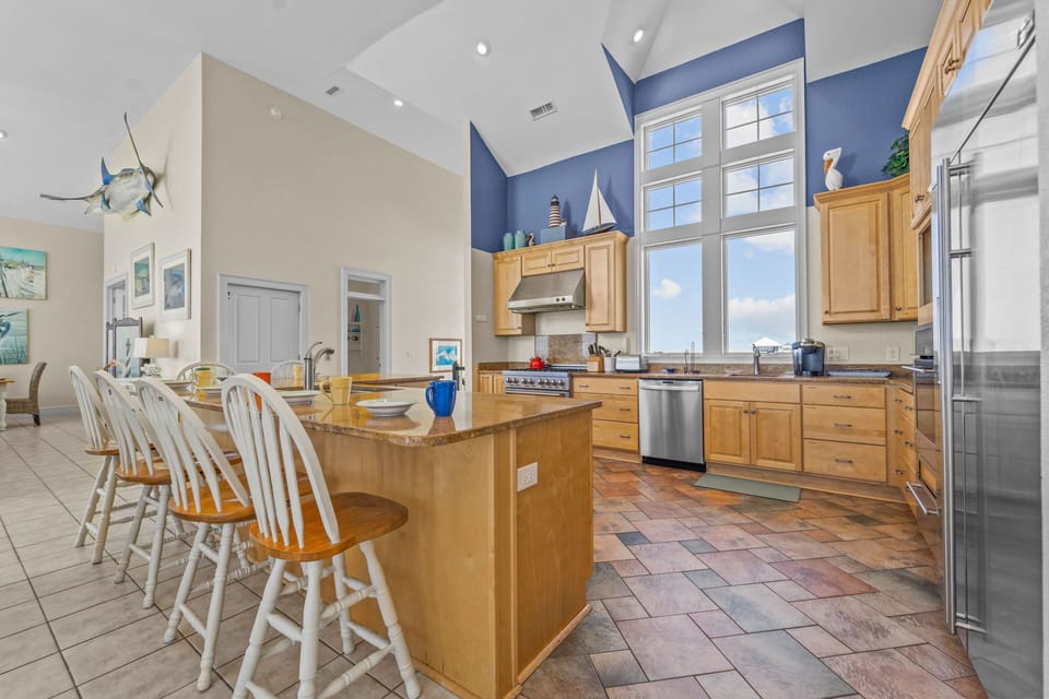 The top level well-equipped kitchen features stainless steel appliances including a warming drawer and 2 dishwashers.