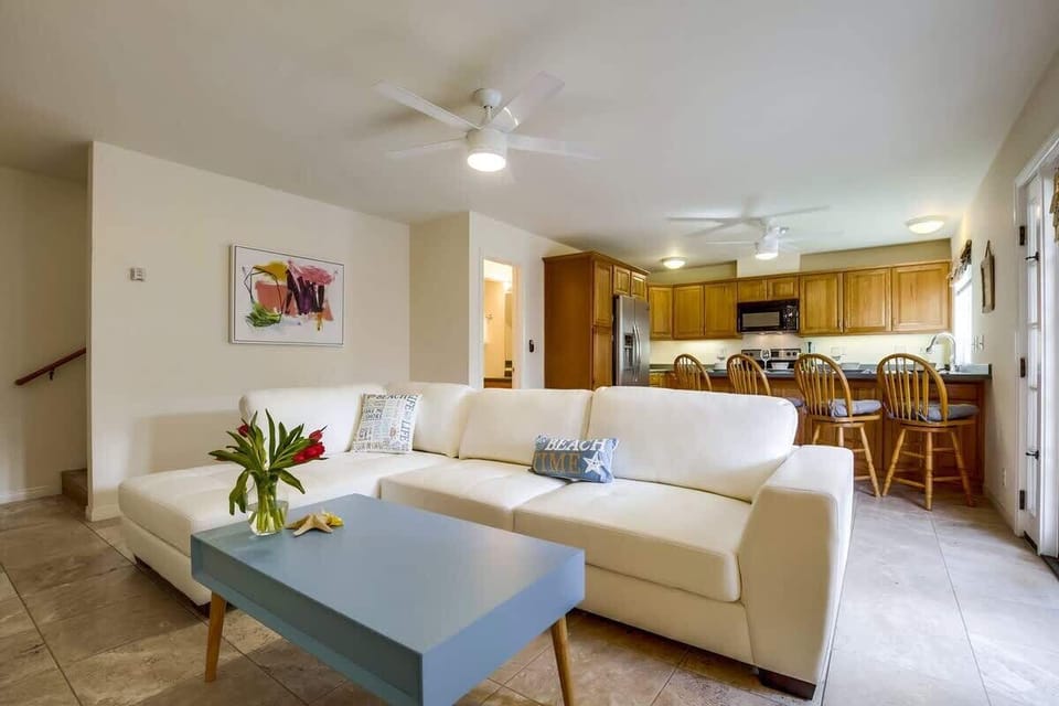 Open concept living room leads right into kitchen.