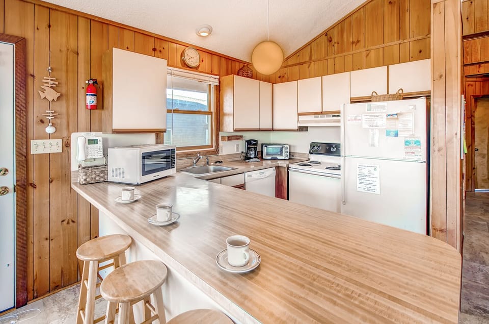 Spacious bright kitchen with traditional appliances.