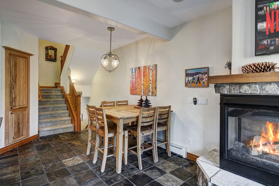 Dining area with adjacent fireplace.