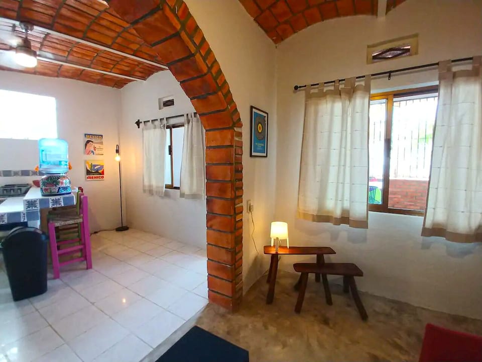 Loft style entertaining kitchen opens to the living room with sofa bed. 