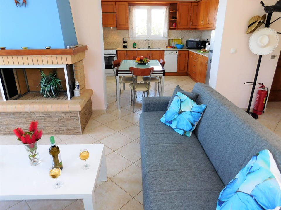 Villa Maria living room and kitchen, and door to downstairs bedroom.