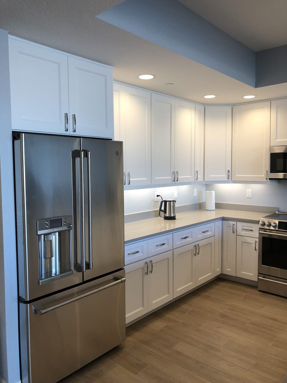 stainless steel fridge with water purifier and ice maker on door