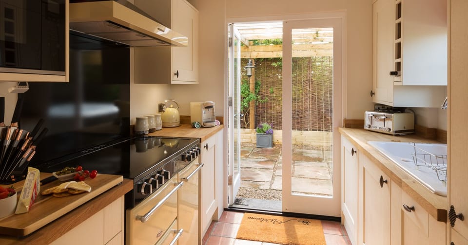 The very well equipped kitchen includes dual washing machine and tumble dryer.
