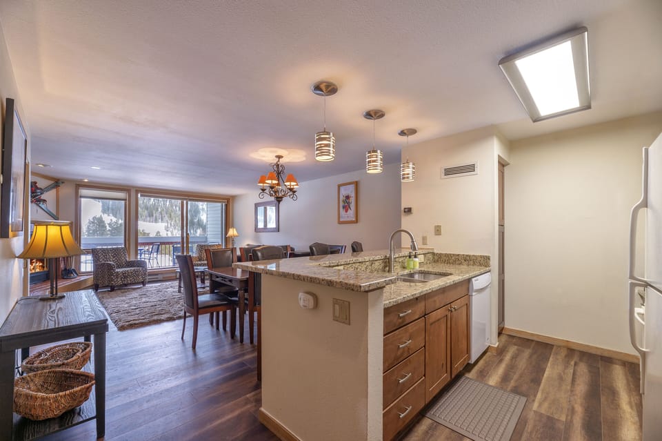 The 1st level has the kitchen, living room, deck, master bedroom, and Bath 1.