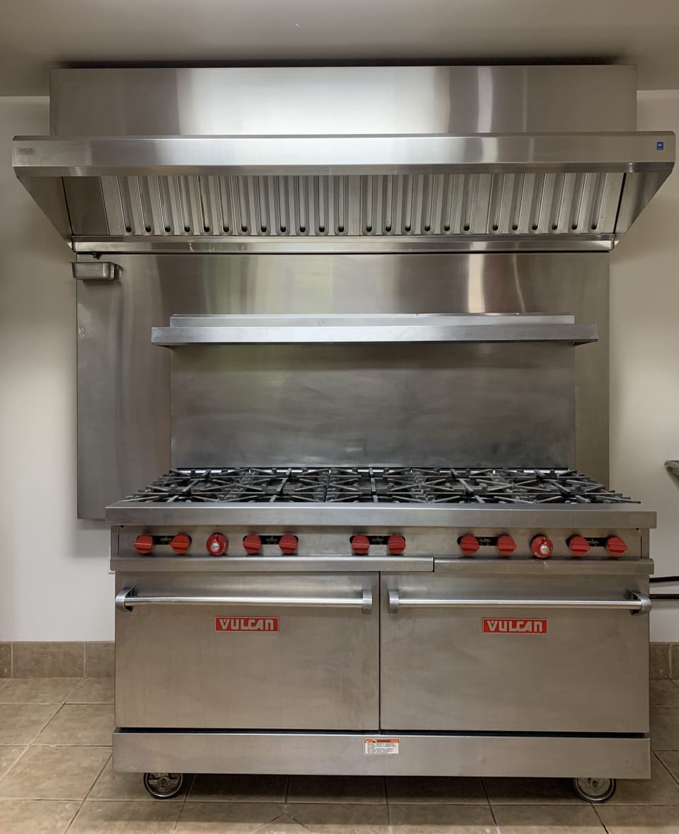 Vulcan commercial range. 10 Burner with 2 Ovens. Commercial Venting System.