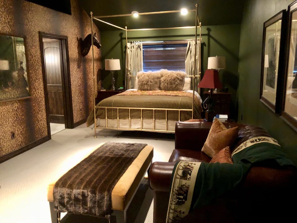 Master Suite 1 features a King Bed,  leather couch and attached private bathroom