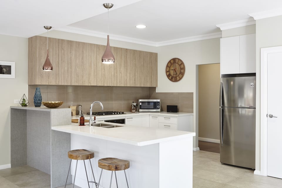 Kitchen with breakfast bar and coffee machine 