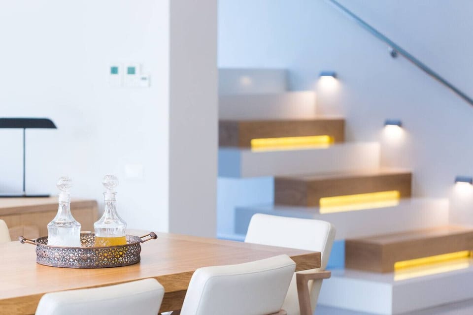 Bright, elegant staircase providing a graceful transition to the upper bedrooms