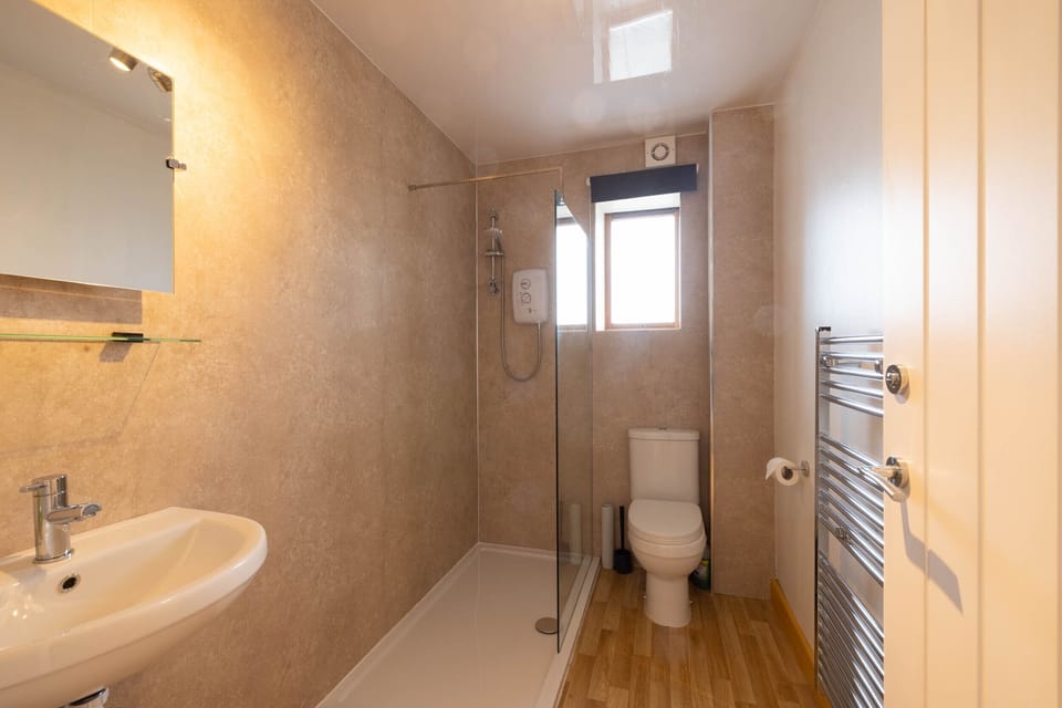 Bathroom with walk-in shower.
