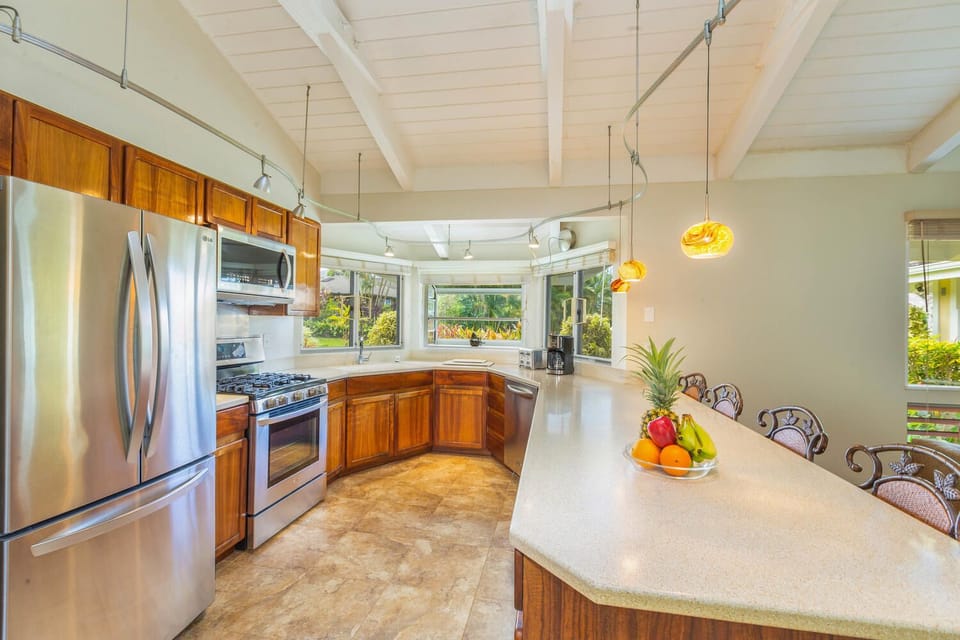 Bright, modern kitchen at Mala Hale with stainless steel appliances and garden views