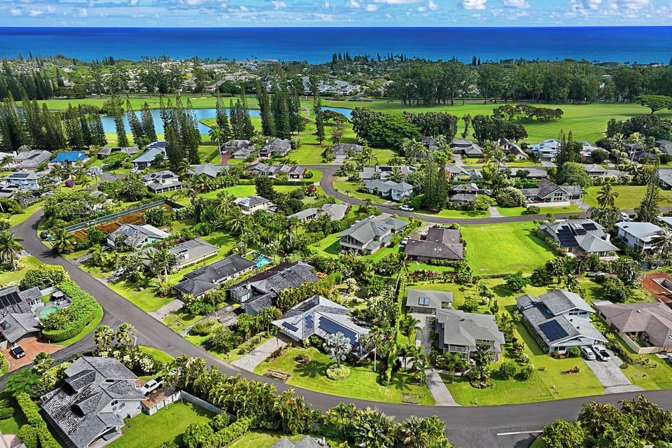 Aerial view of Princeville neighborhood with ocean in the distance