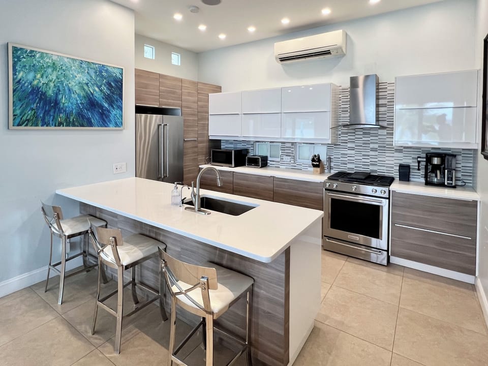 Chefs delight at this European-style kitchen, sleek design and hidden silverware