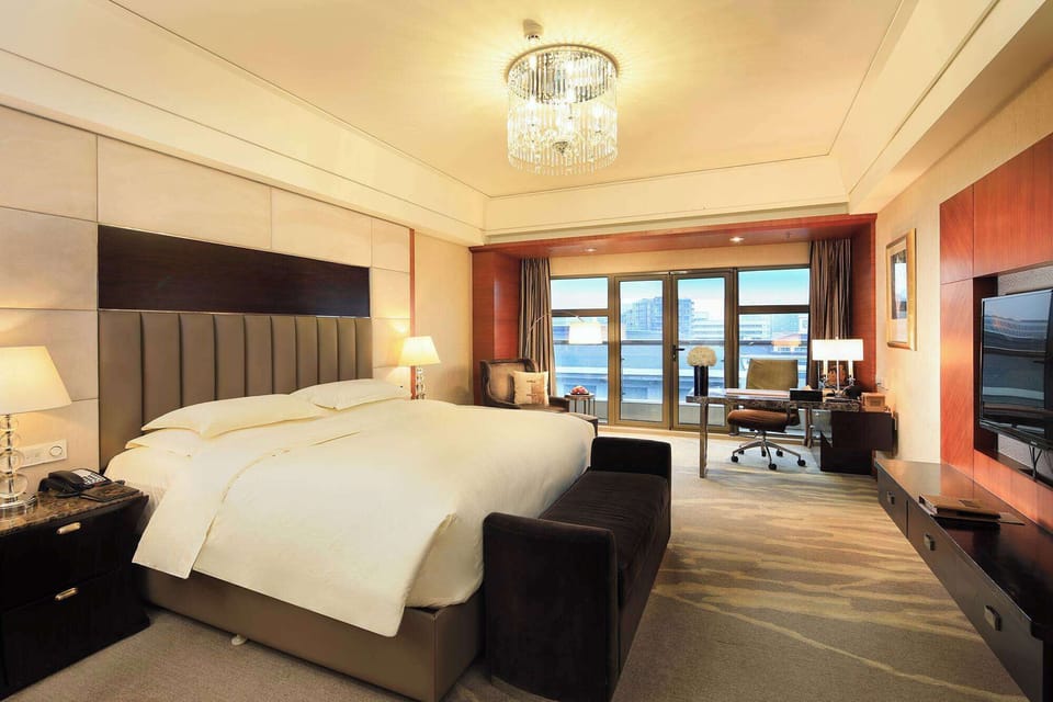 Premium bedding, down comforters, minibar, in-room safe