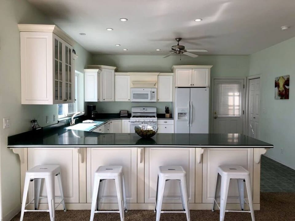 Full kitchen with bar stool kitchen eating
