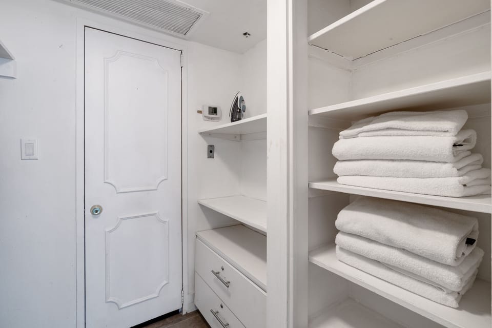 Large closet area in the large bedroom with two full beds 
