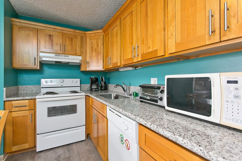 Full kitchen with cooking utensils