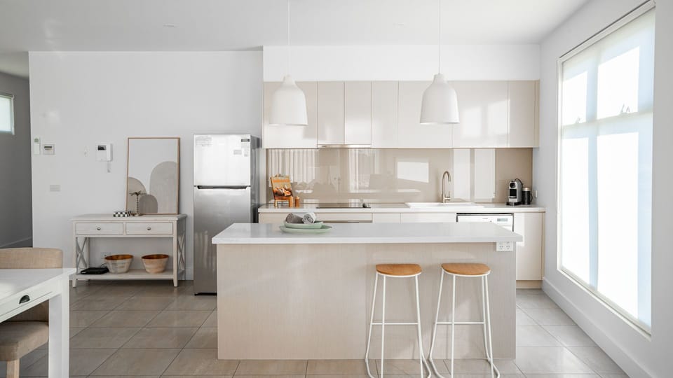 Modern kitchen with all the essentials and seating for two at the breakfast bar