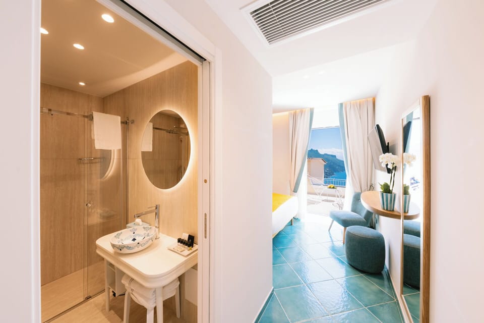 Design Room | Bathroom | Shower, rainfall showerhead, designer toiletries, hair dryer