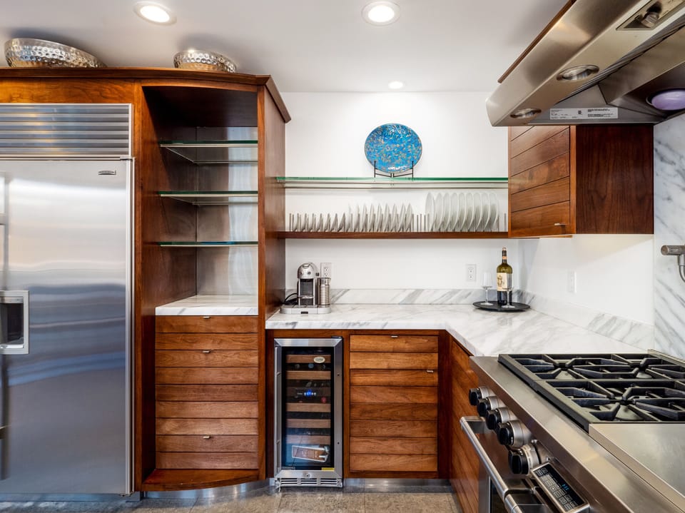 Beautiful Walnut kitchen stocked with everything you would need to cook/enjoy. 