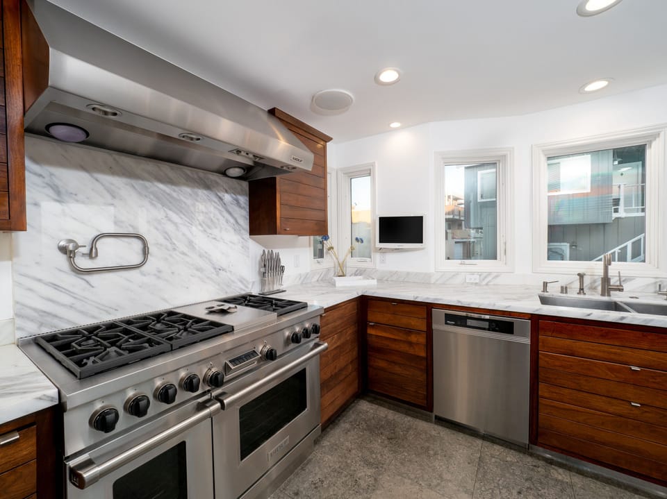 Beautiful Walnut kitchen stocked with everything you would need to cook/enjoy. 
