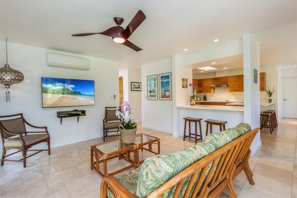 Settle in for a movie night or relax after a beach day in this bright, cozy lounge with flat-screen TV.