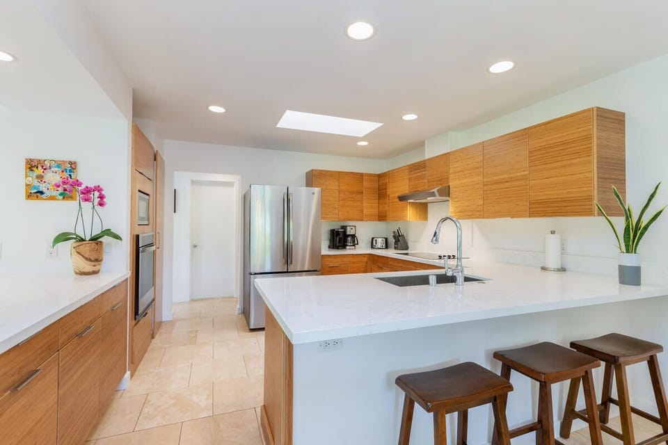 Enjoy preparing fresh meals in the fully equipped kitchen with bar seating for casual gatherings.