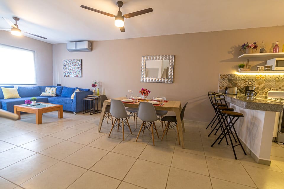 Panoramic view of downstairs living,  dining  area and kitchen.