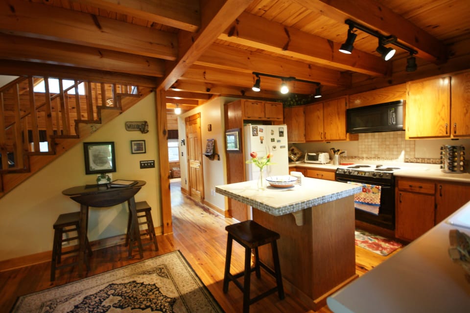 Keep the chef company at the kitchen island while they are preparing a meal