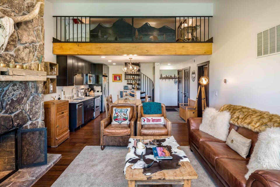 Living area, looking towards kitchen and upstairs loft