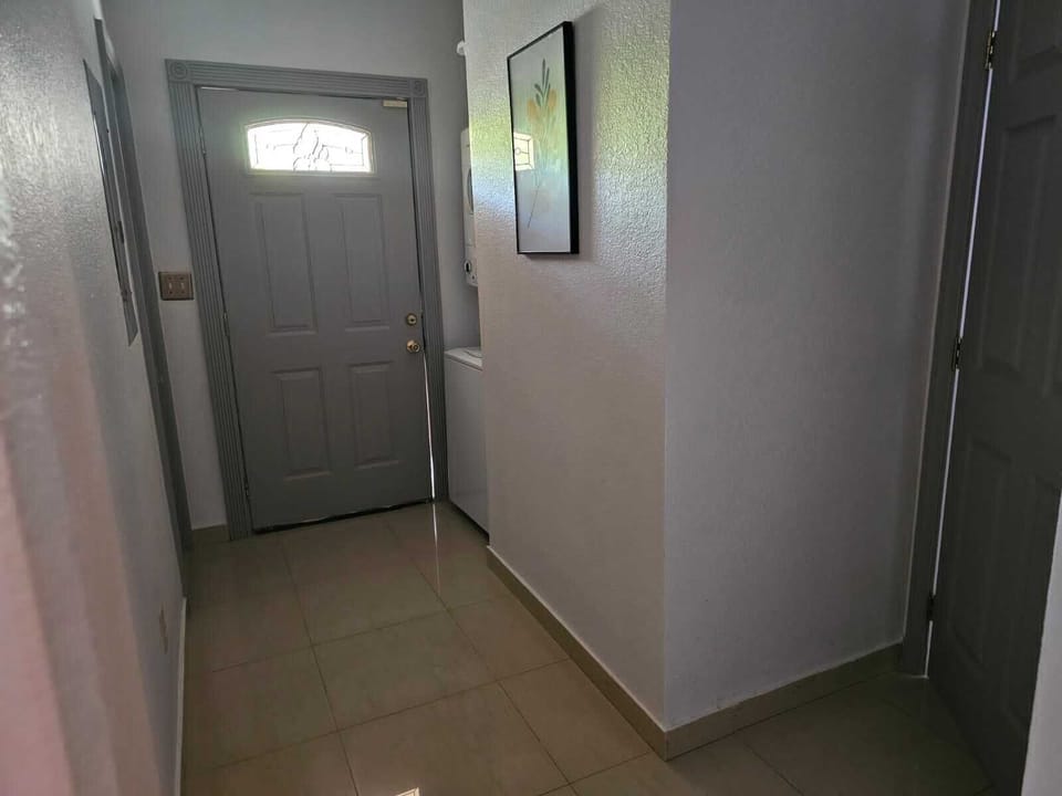 Hallway leading to rear patio area.