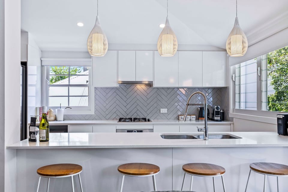 Full cookware, clean finishes and generous kitchen bench space.