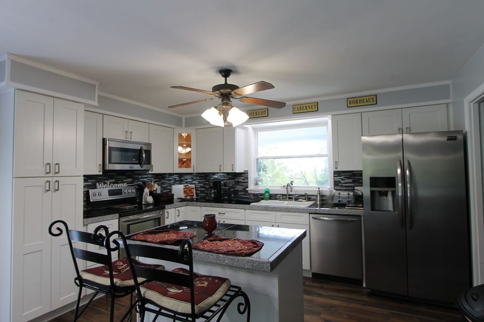 Kitchen has 12-cup coffee maker, 4-slice toaster, pots, pans and dishes for 10. 