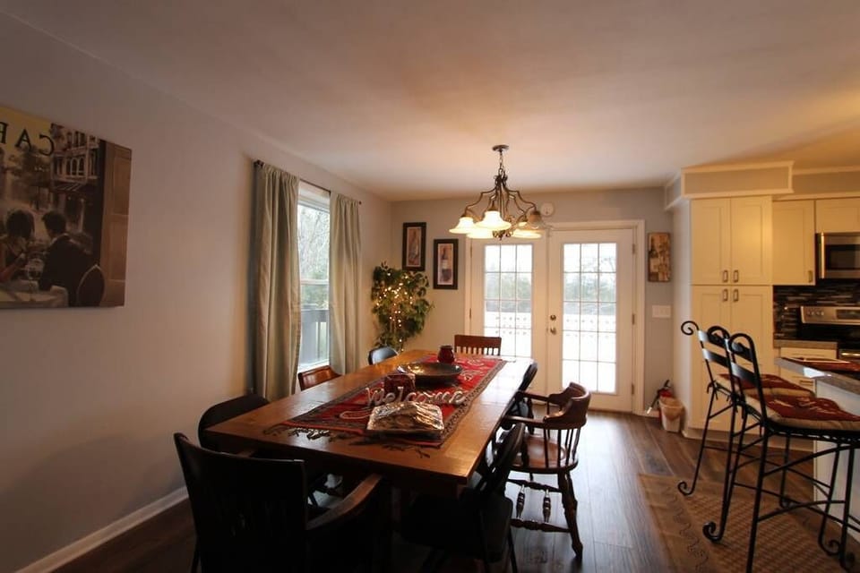 11/29: Natural wood dining room table seats up to 12.